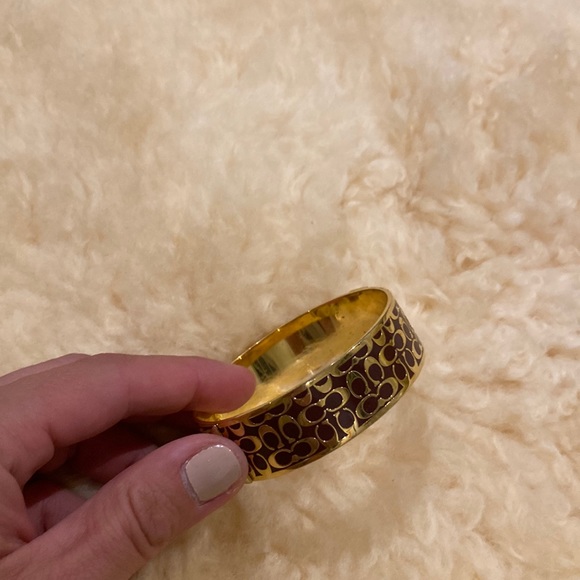 Gold tone and brown enamel Coach bangle. Medium size. Great condition.